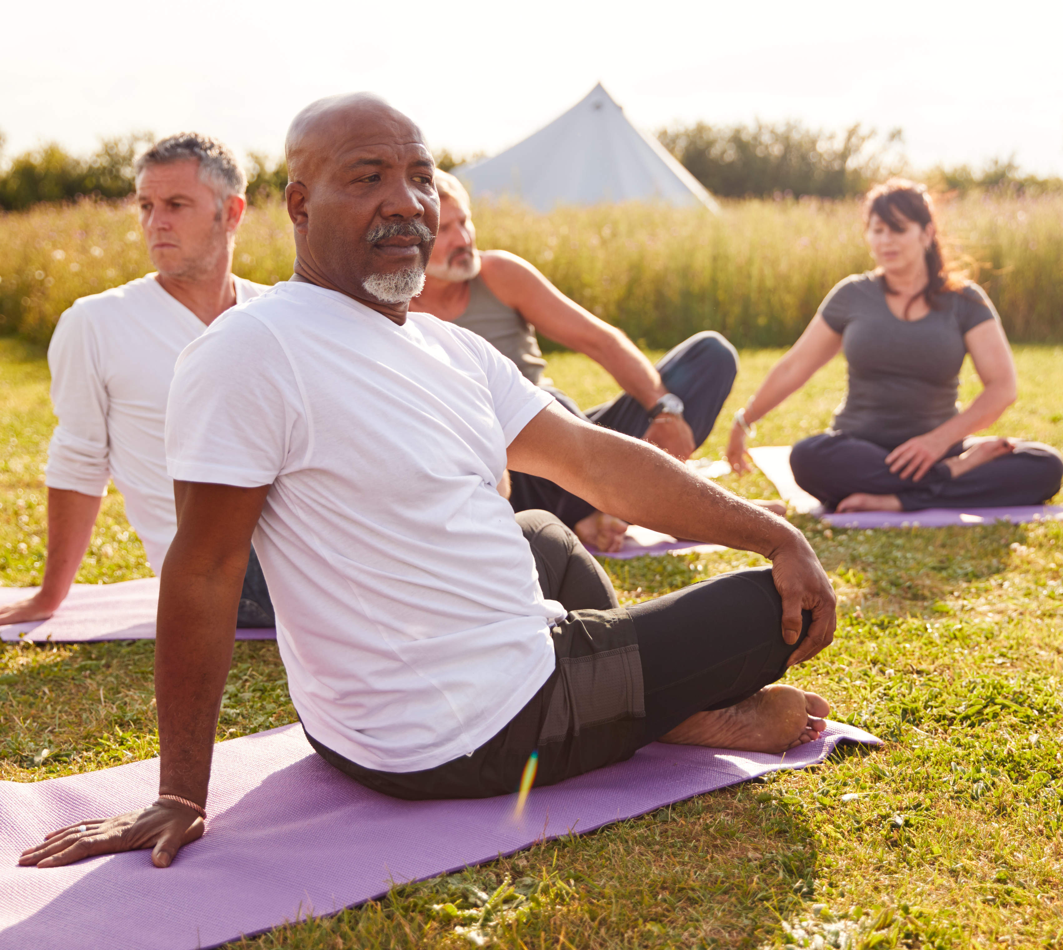 Black man doing stretches outside