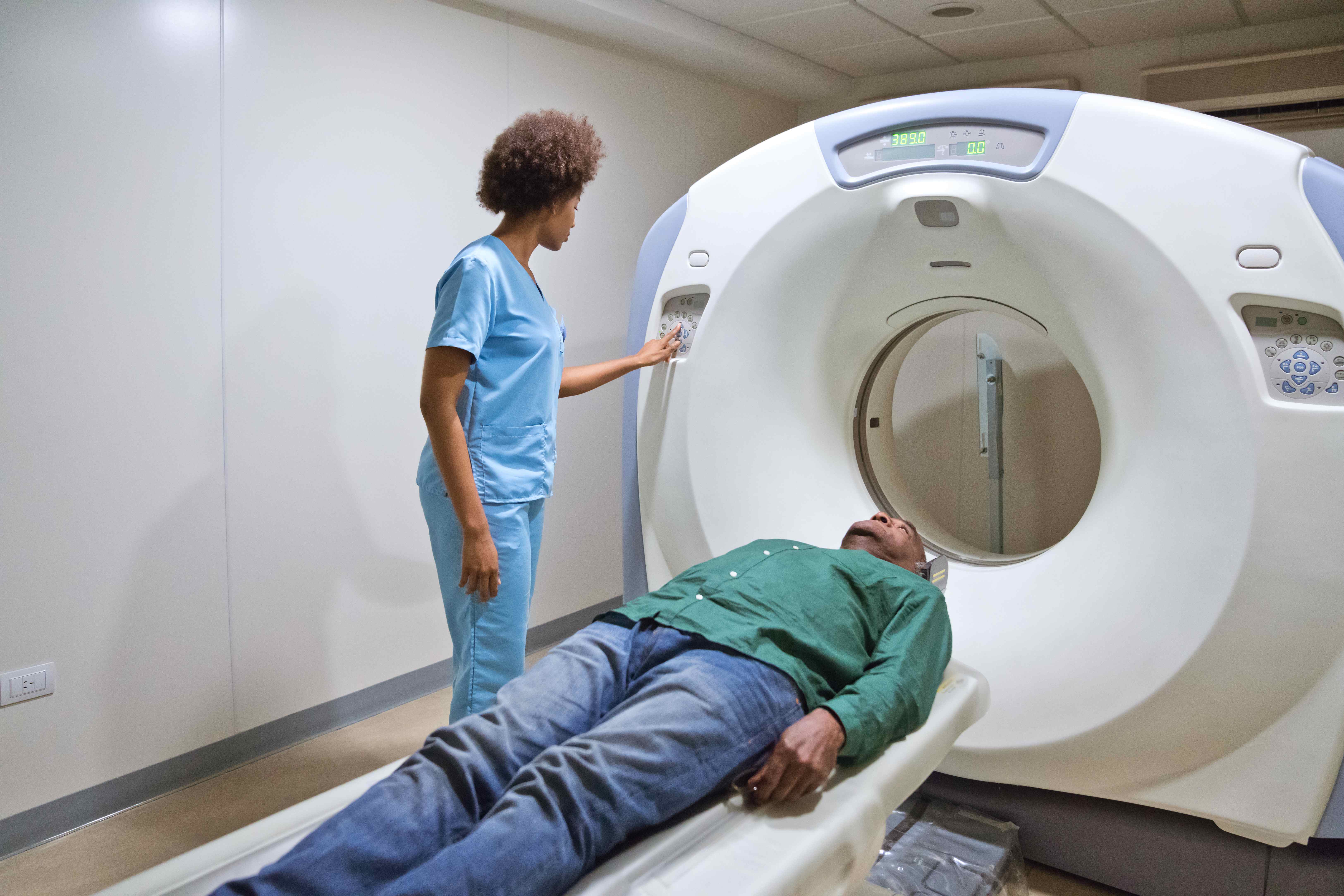 Black patient in CT scanner