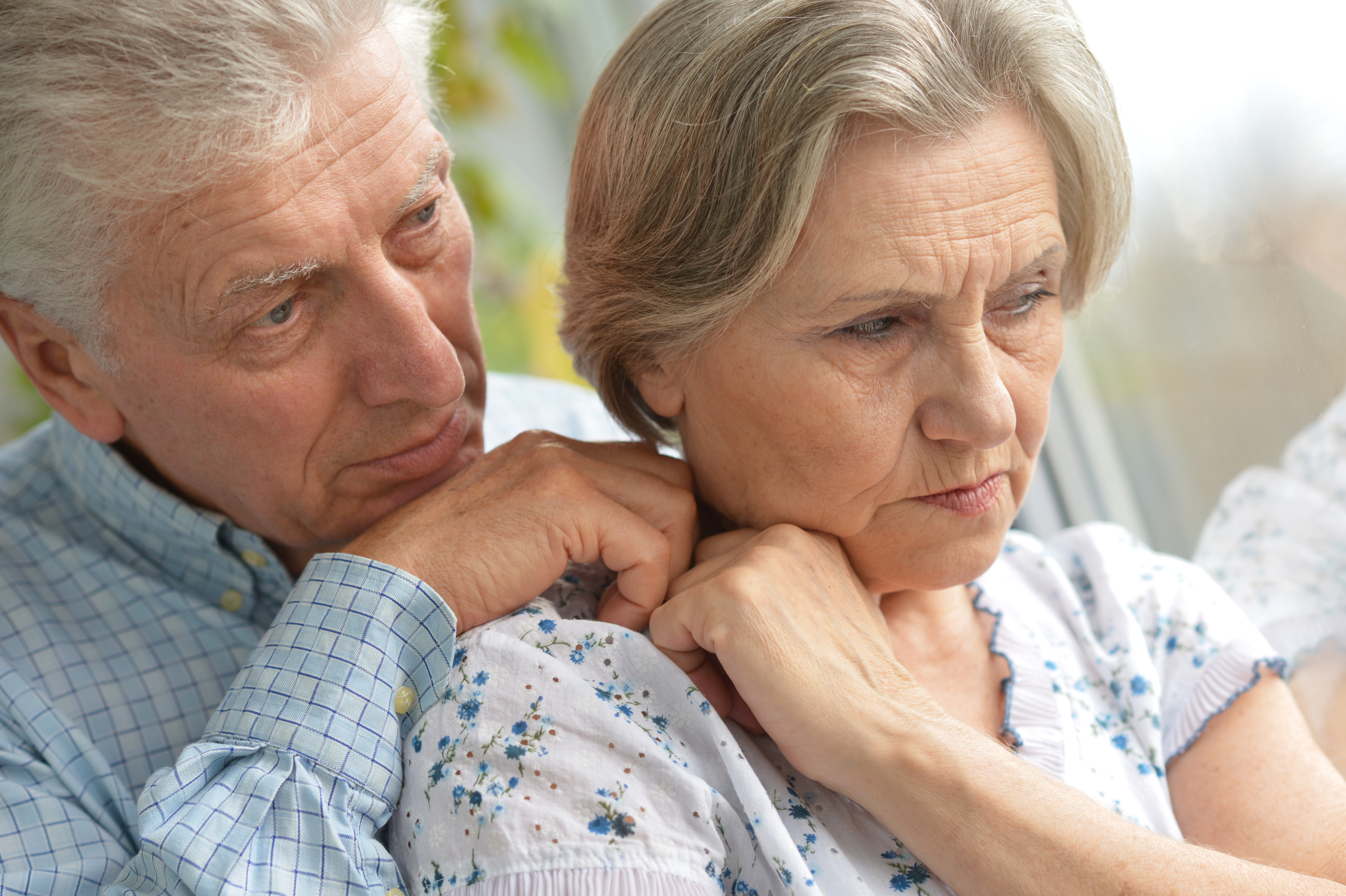 Man supporting his partner who looks worried