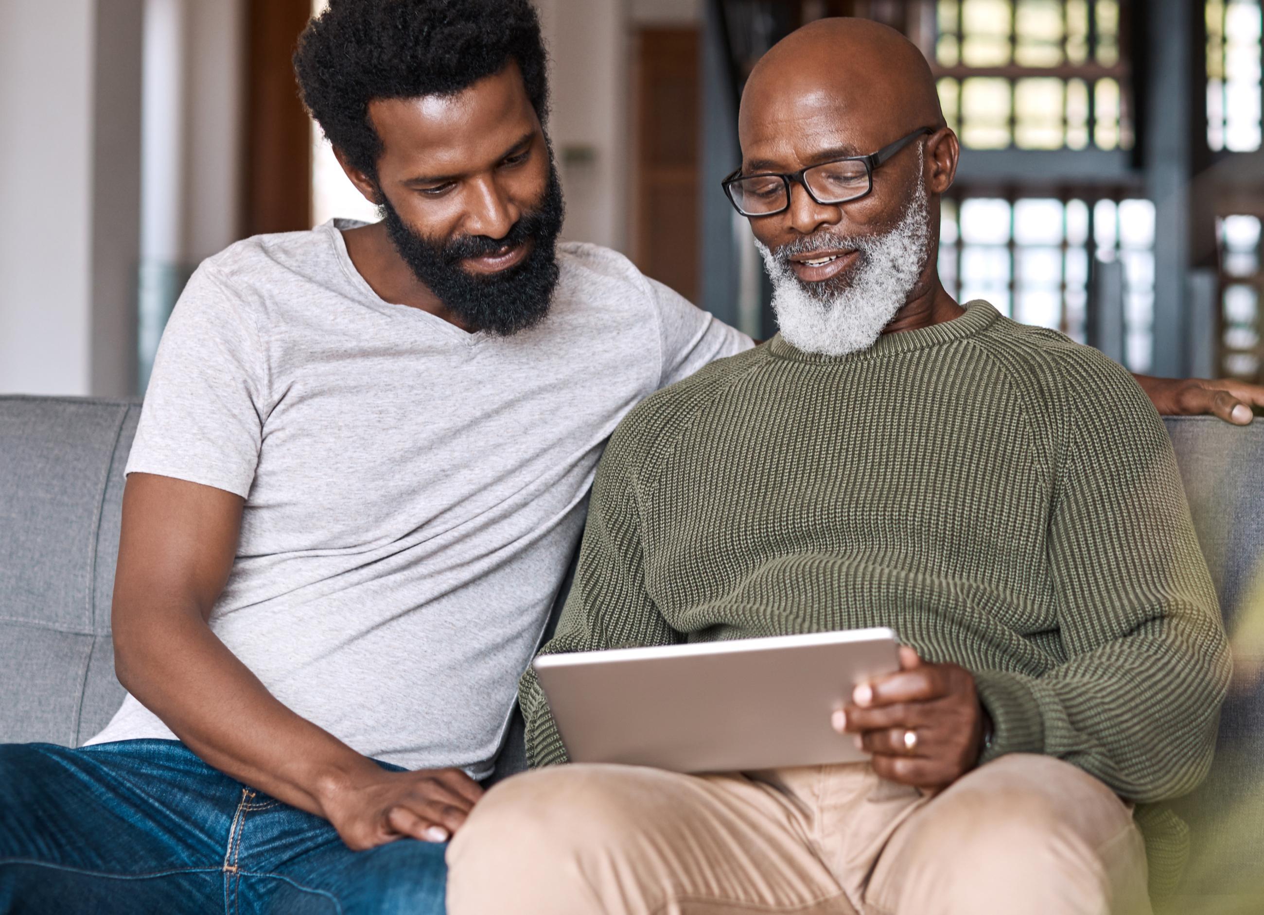 two males watching the infopool demo video together